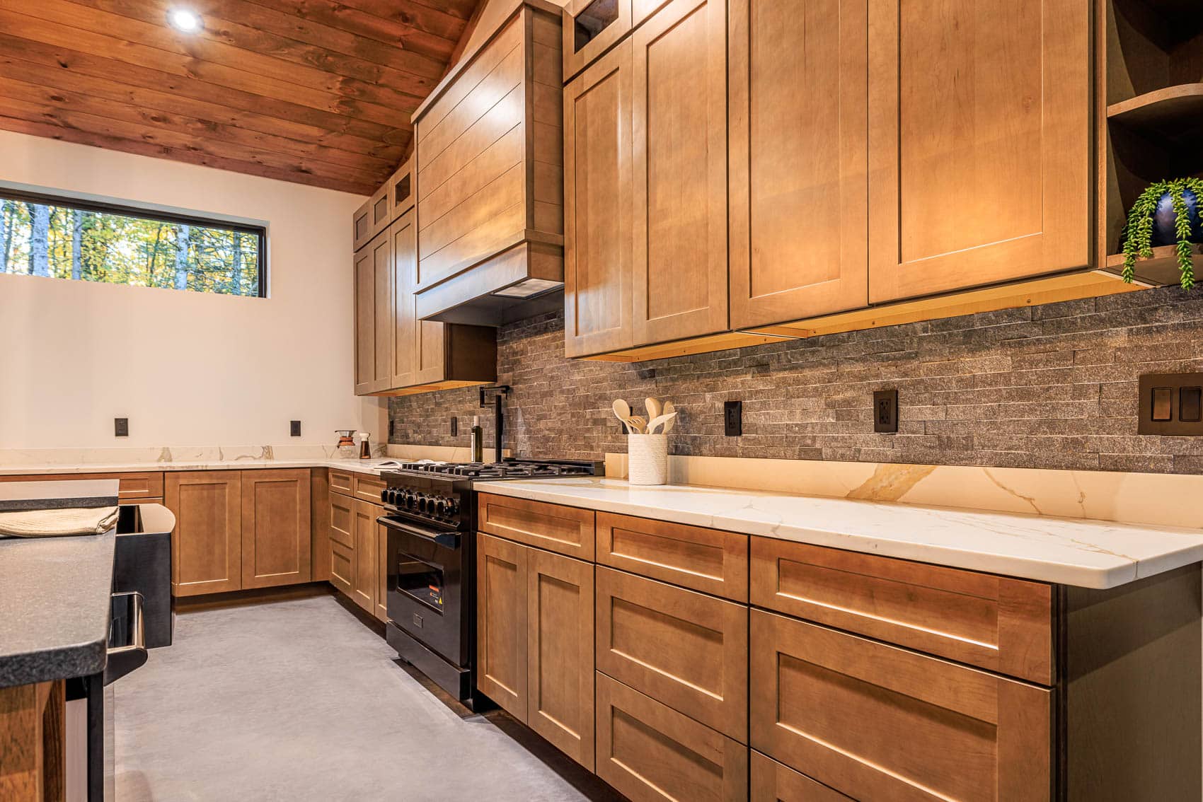 Custom wood kitchen inside blue barndominium home