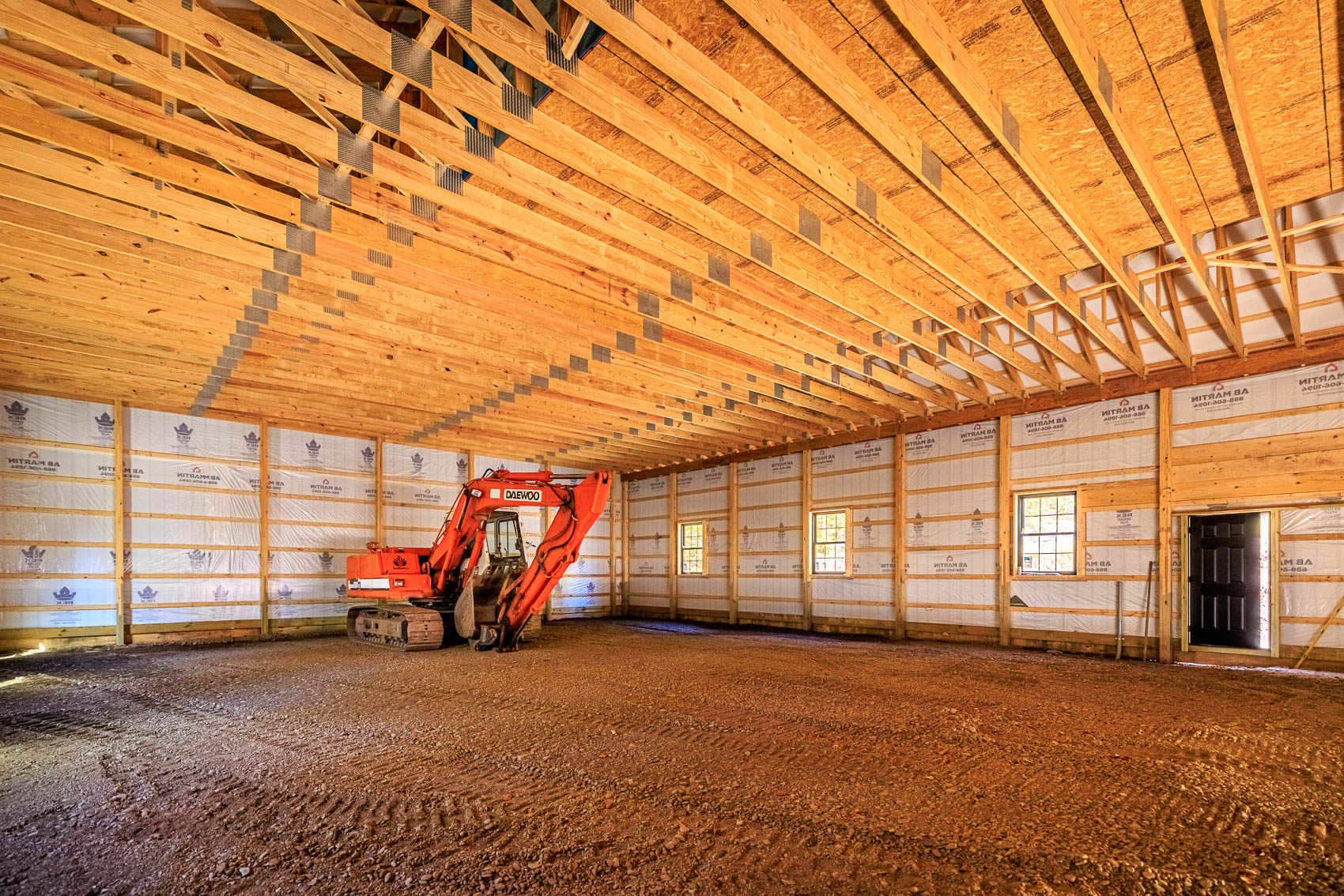Interior framing and trusses inside a custom post-frame barn